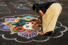 Continuing the tradition of drawing Pongal symbols on the ground, Tamil Nadu, India