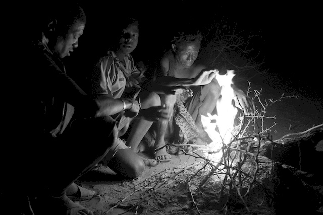 Hadzabe hunters before dawn gathered in preparation for hunting, Tanzania